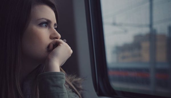 Picture of woman looking out of train window